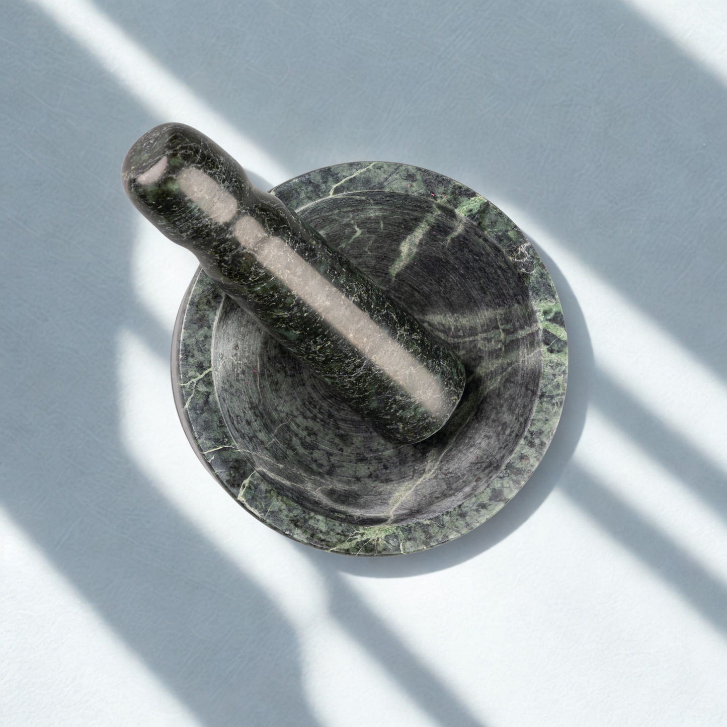 Large green stone mortar