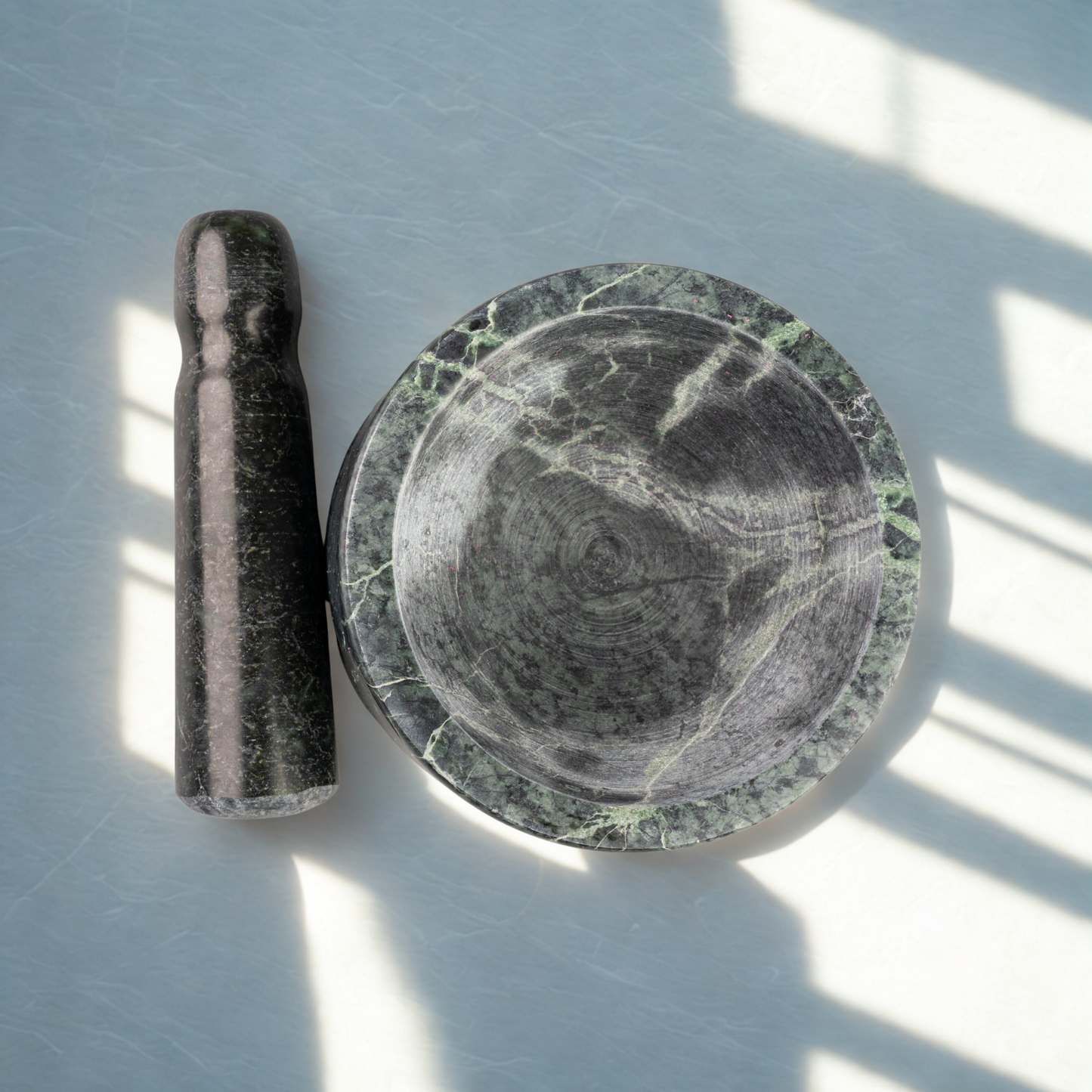 Large green stone mortar