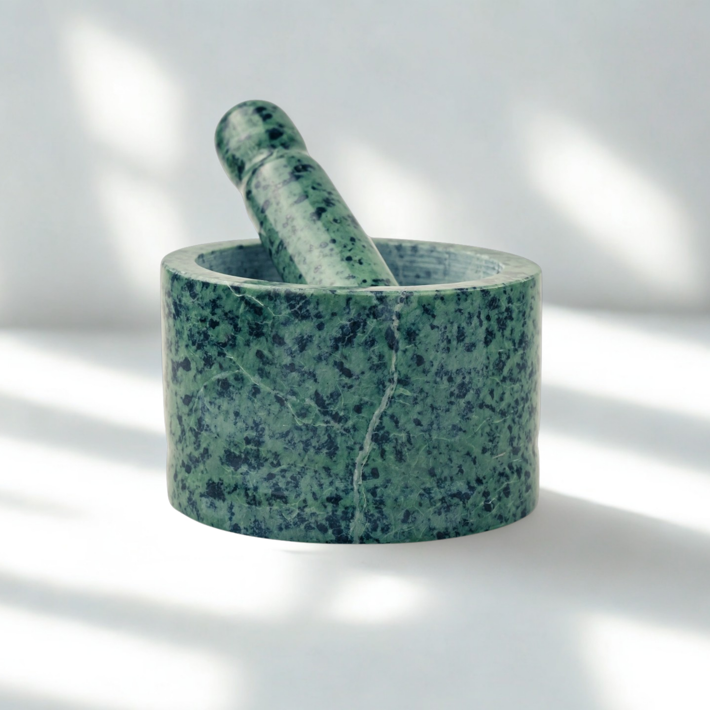 Large green stone mortar